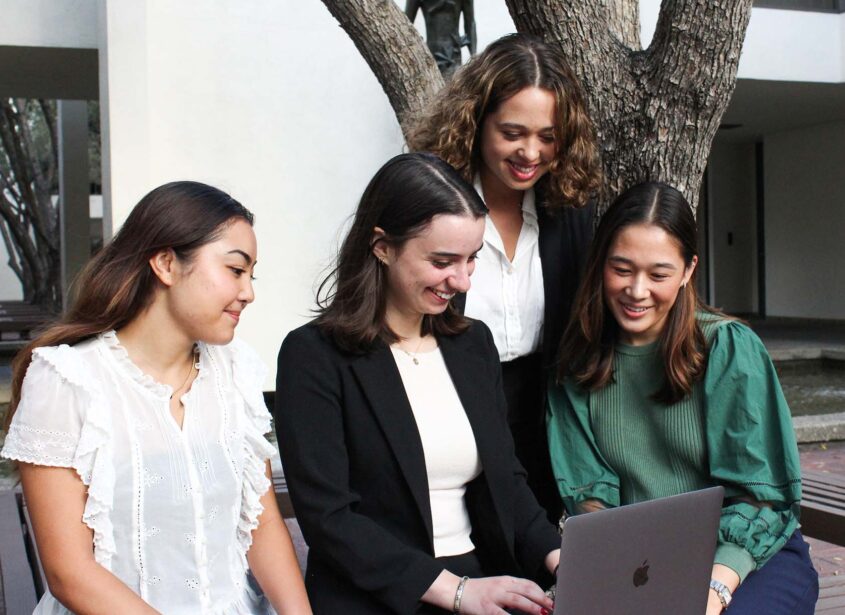 Scripps Store - Students in group around laptop